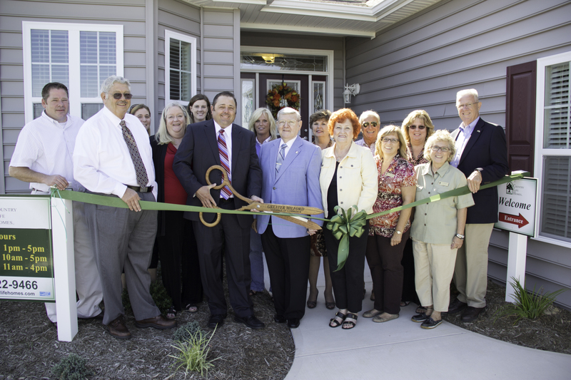 Participating inthe Hearthstone grand opening are in back (l-r) Todd Fannin, Laurie Judd from the Milford Chamber of Commerce, Nancy Groom, Mary Beth Cross, Ronda Myers, Carol Wilkins, Milford City Councilman Skip Pikus, Robin Bunting, and Rep. Harvey Kenton, R-Milford. In front are Elmer Fannin, Michael Fannin, Milford Mayor Ronnie Rogers and his wife Ruth, Mary Ann Walko and Chris Miller-Marcin. SOURCE SUBMITTED